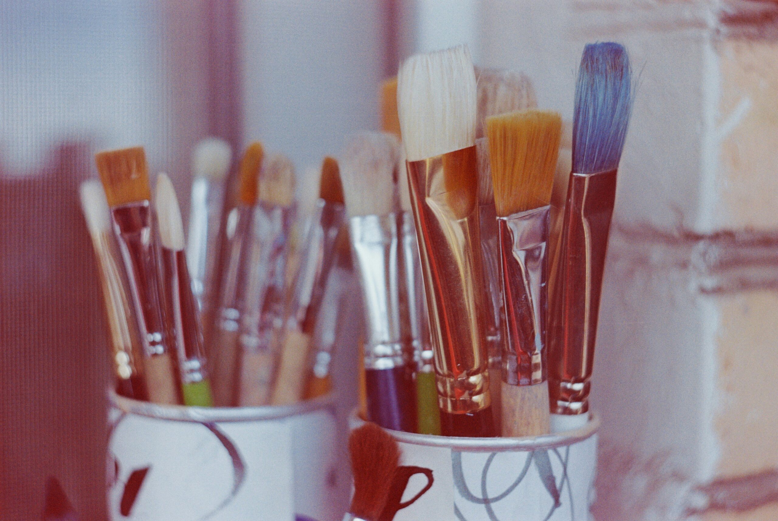 A close-up shot of a sleek, compact makeup palette featuring multiple colors.