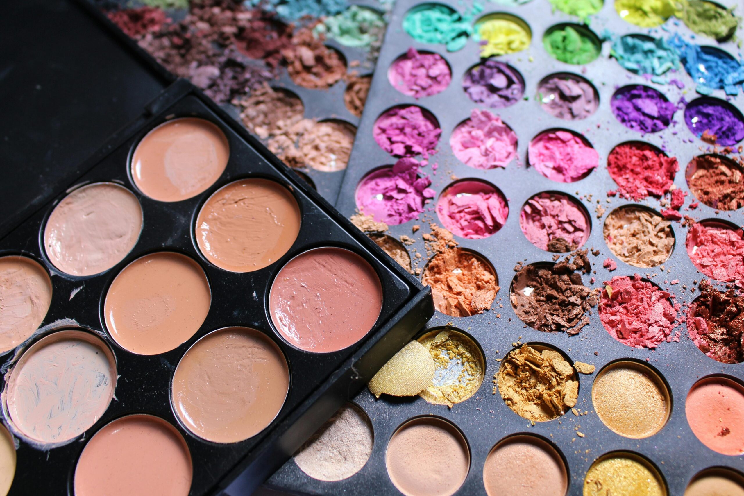 A sleek All-in-One makeup palette featuring foundation, contour, blush, and highlight shades