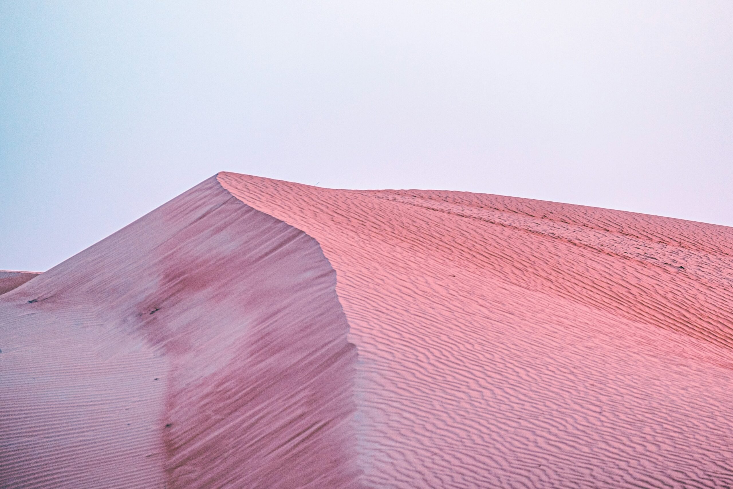 Close-up shot of the Huda Beauty Desert Dusk Mini Palette, showcasing its compact design and vibrant shades.