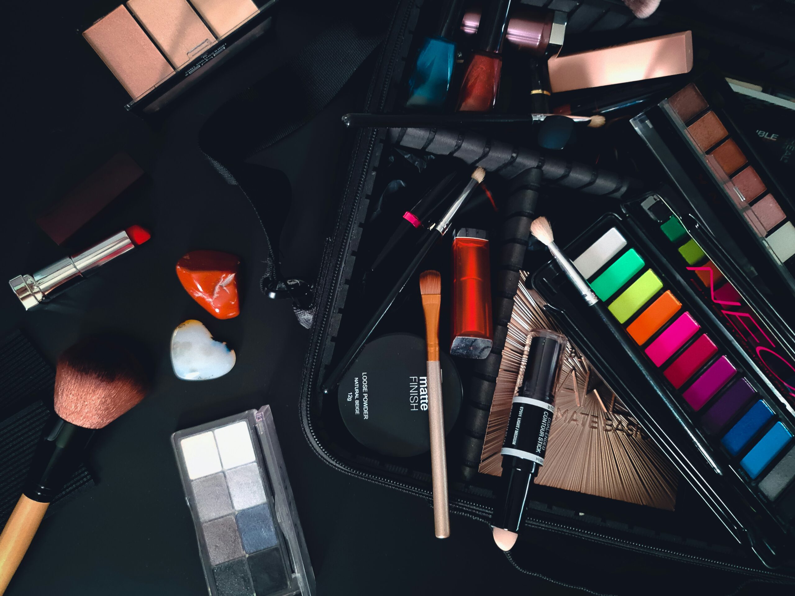 Swatches of universal palette shades on various skin tones