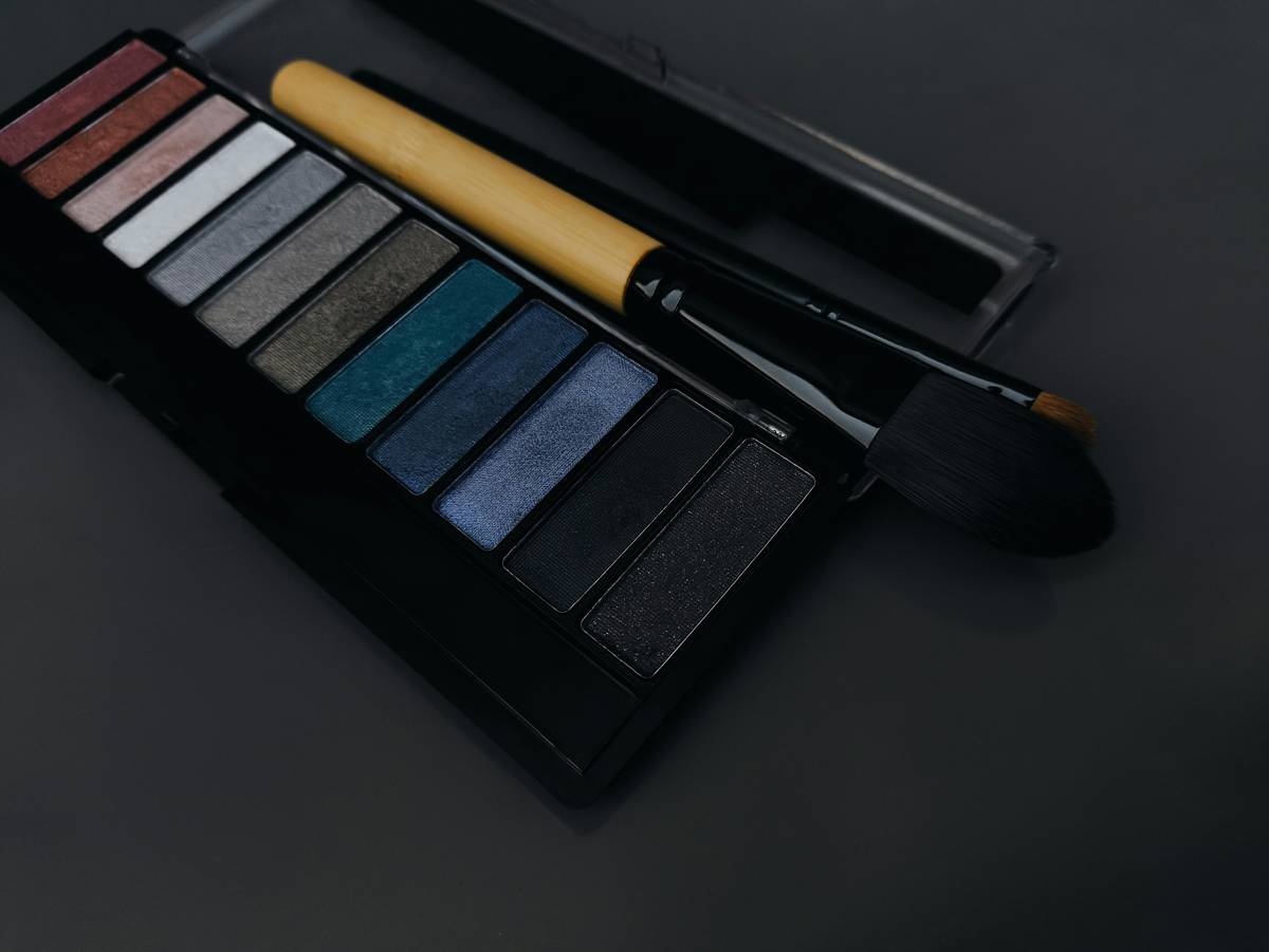 A sleek portable cosmetic palette containing eyeshadows, blushes, and highlighters.