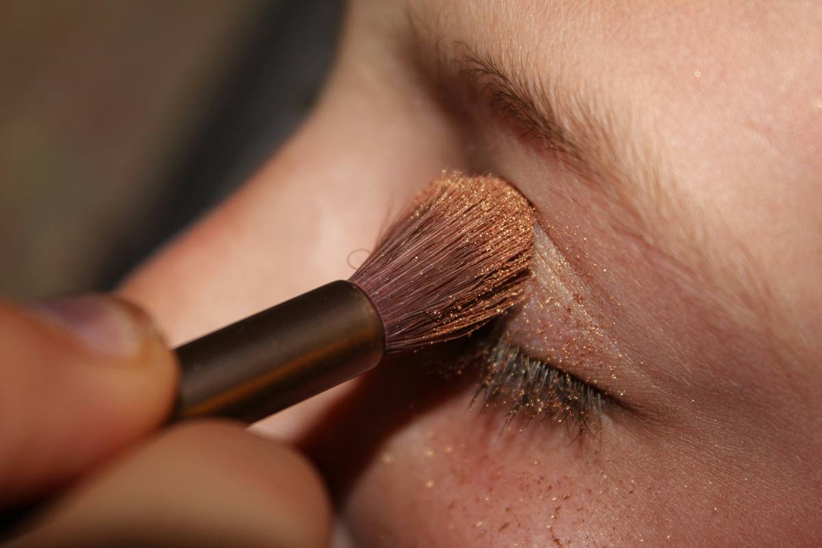 Eyeshadow swatches being tested on the back of a hand for longevity
