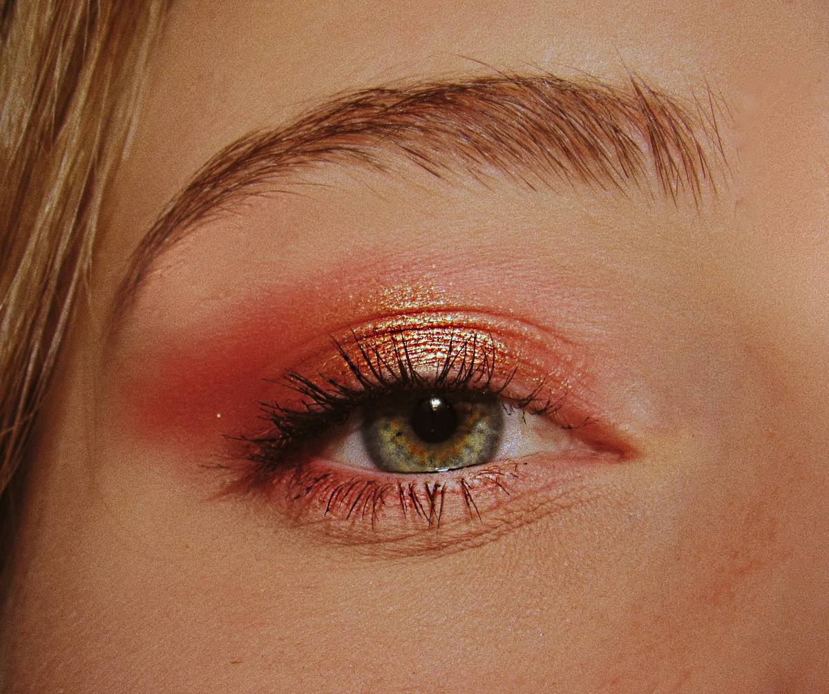 Close-up image showing step-by-step process of blending textures on eyelids.