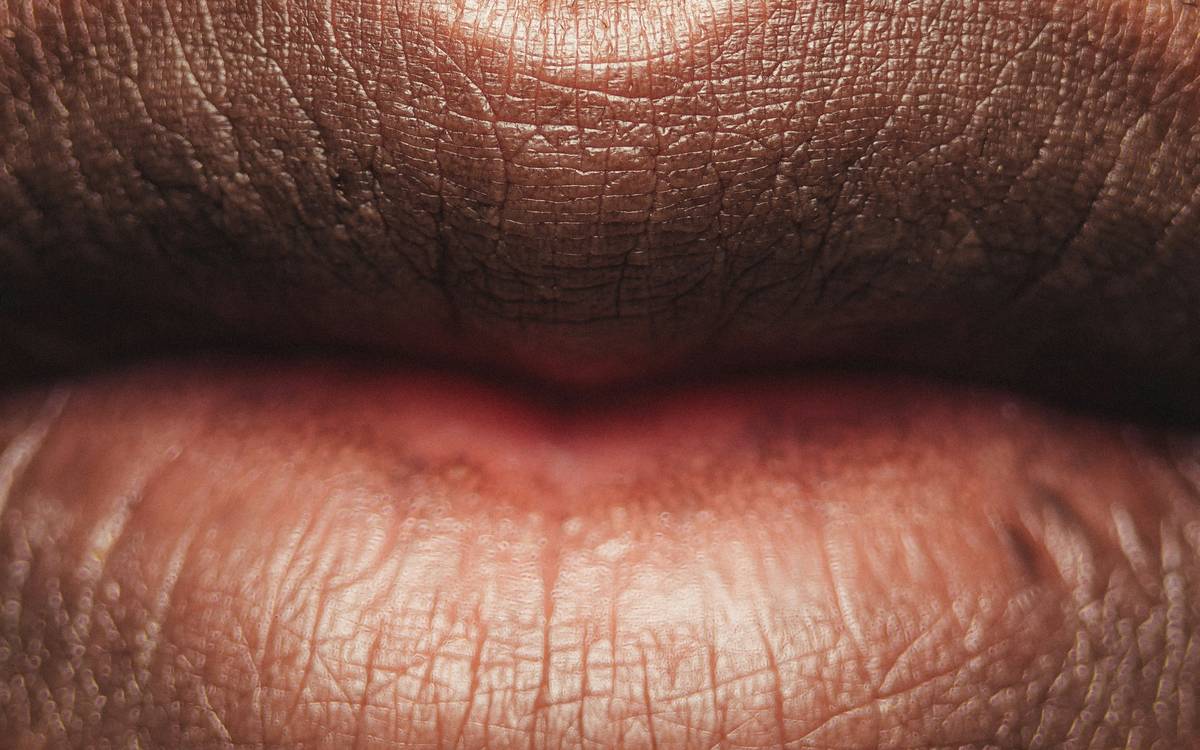 Woman confidently posing after applying a lip and cheek palette
